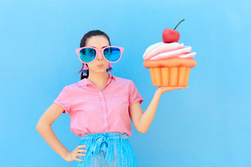 Funny Party Girl with Big Sunglasses and Huge Cupcake 