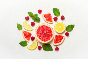 Citrus, raspberry and mint on white. Health detox concept