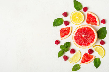 Citrus, raspberry and mint on white. Health detox concept