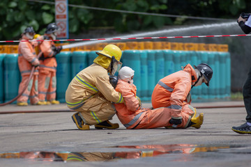 Disaster training Emergency service workers evacuate a 'survivor' from the gas station in Lampang,...