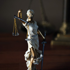 Themis with scales in lawyers office.  Statue of blind goddess 