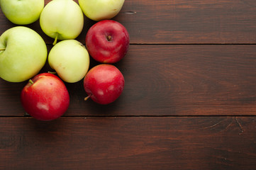 Red apples on the rustic wooden table