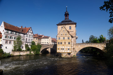 Bamberg. Panoramic view of Old Town Hall of Bamberg (Altes Rathaus) with two bridges over the Regnitz river, Bavaria, Germany