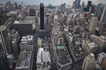 Fototapeta na wymiar Manhattan street view and Nyc buildings from Empire State Building in New York City