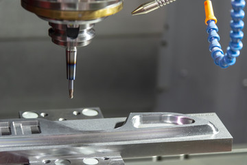 The CNC milling machine cutting the  automotive mold part with the solid ball endmill tool. Modern...