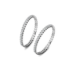 A pair of luxury white gold rings with diamonds on the white background, isolated, golden rings isolated