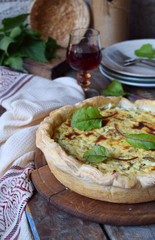 Homemade spinach, chard and nettle quiche. Freshly baked pie with feta cheese. Healthy food concept. Savory pastry.