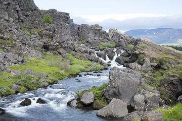Beautiful waterfall on the cliff side