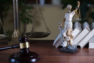 Themis with scales in lawyers office.  Statue of blind goddess 