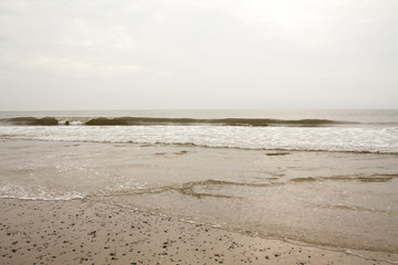 Fototapeta na wymiar North Sea beach in Denmark at cloudy day.