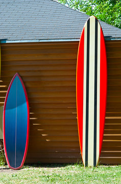 Surfboards next to the house in nature