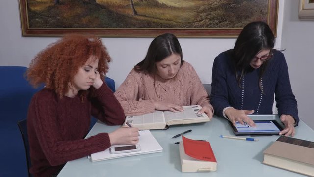 portrait of Study group. student is distracting by the smartphone, her friend scolding her