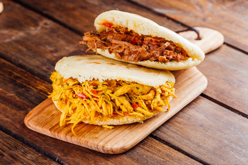 Typical South American breakfast, arepa with chicken and roasted meat