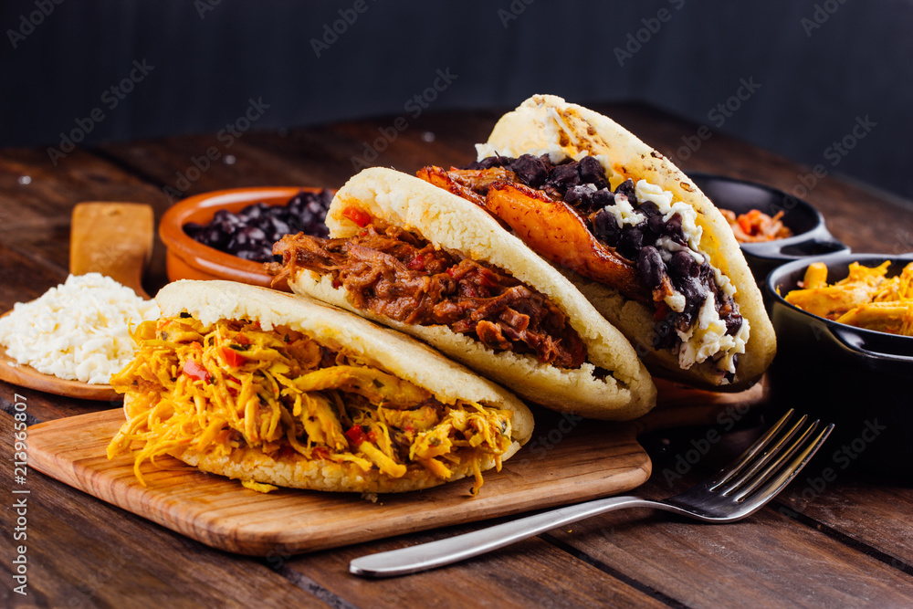 Wall mural latin american breakfast, arepas with several ingredients.