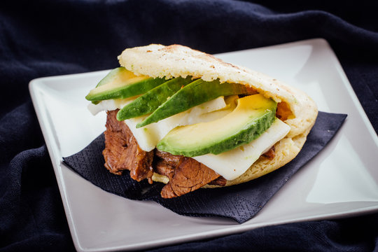 Arepa made with avocado, meat and cheese