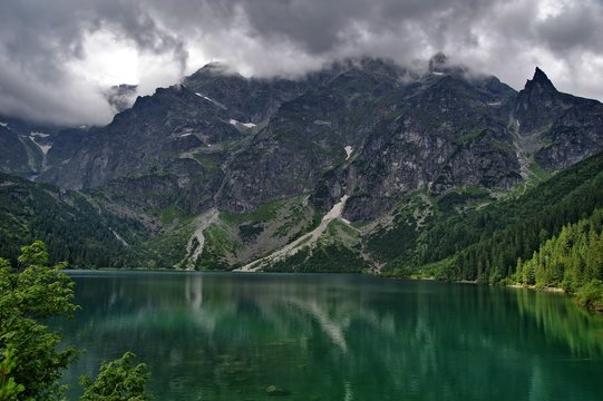 Fototapeta Morskie Oko lake in Polish Tatra mountains on cloudy day. 