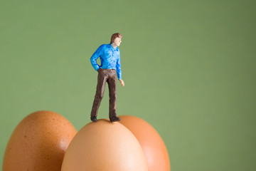Walking on Eggshells - model figure on top of eggs