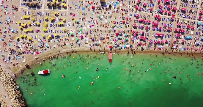 Aerial View From Flying Drone Of People Crowd Relaxing On Beach In Romania At The Black Sea
