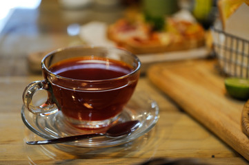 A cup of hot tea is placed on the table,Selective focus