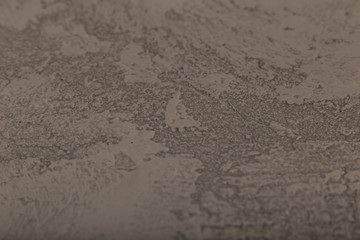 Raw or bare concrete wall, shot with panel seam lines perpendicular to image dimension