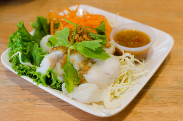 Boiled fish with vegetable and spicy sauce