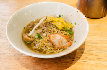 thai food, yellow noodlw with slice pork