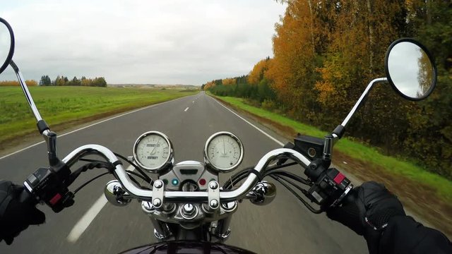 4K. Fast motorcycle riding on the beautiful road, wide point of view of rider. Classic cruiser/chopper forever! 