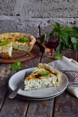 Homemade spinach, chard and nettle quiche. Freshly baked pie with feta cheese. Healthy food concept. Savory pastry.