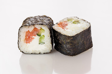 Sushi roll isolated on white background with reflection. Creative layout made of sushi. Flat lay. Food concept. Macro concept.