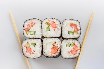 Traditional fresh japanese sushi rolls isolated on white background. Top view