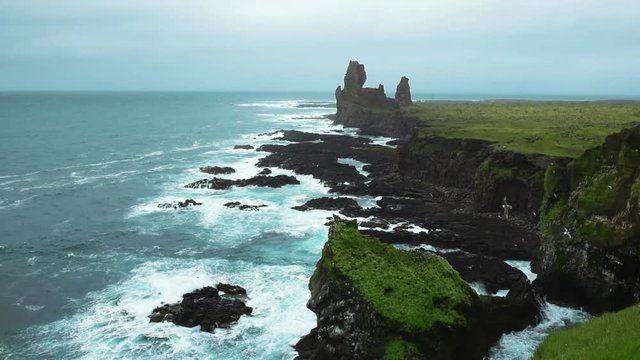 Beautiful landscape showing Londrangar Cliffs on Snaefellsness, West Iceland. Top view footage video of beautiful Icelandic nature in summer. Gull birds flying