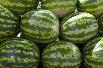 Market counter with delisios watermelons.