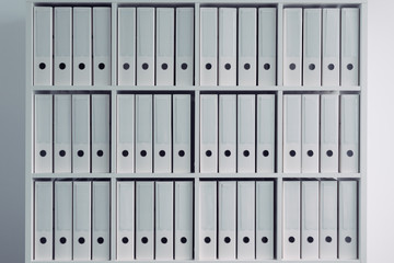 Office shelf with file ring binder folders