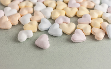 Fototapeta na wymiar colorful candy hearts on craft background