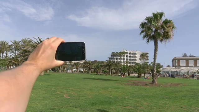   Professional video series of POV taking a selfie photo in Maspalomas Grand Canary in 4K Slow motion 60fps