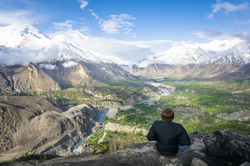 Naklejka na ściany i meble a traveller/hiker enjoys the beautiful view of Hunza valley Pakistan