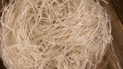 Close up of dried chinese rice noodles shaped in to a ball for storage