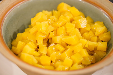 Sweet potato are cut into squares for mix Thai dessert.