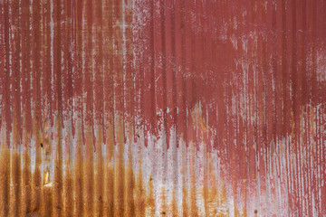 Old Faded and Rusted Red Painted Ridged Metal Surface or Background