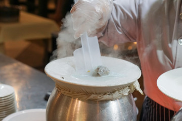 Close up desserts cooking Thai steamed rice-skin dumplings white stuff on the mouth of the boiler.