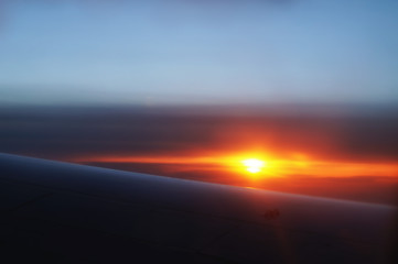 Fototapeta na wymiar The colorful sunset from an airplane view