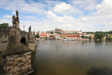 Striking view from the Charles Bridge to the Vltava river, old architecture and modernity