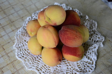 Fresh fragrant and sweet peaches in the basket
