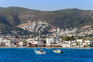 Fototapeta na wymiar Bodrum, Turkey, 23 October 2010: Bodrum Cup Races, Gulet Wooden Sailboats with City View