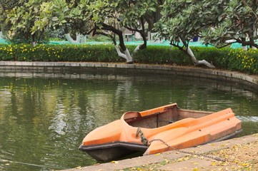 Isolated Orange speedboat in the lake (Kunming, Yunnan, China)