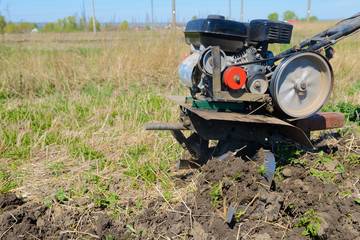 plowing of the land with the help of a motor block