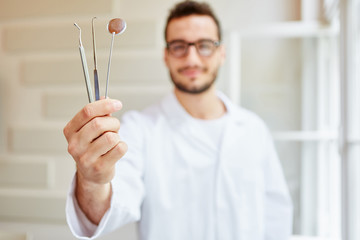 Dental instruments holded by dental nurse