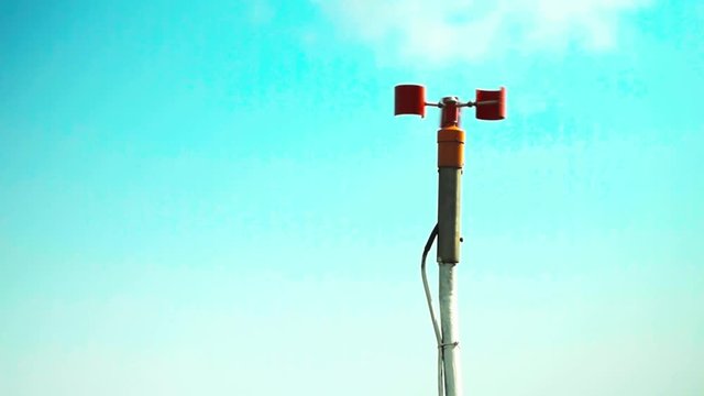 Weathervane on blue sky background