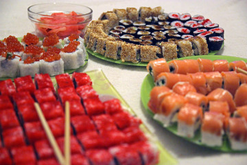 Lunch at a Japanese restaurant. Eating sushi.