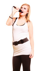 Blonde woman singing to microphone